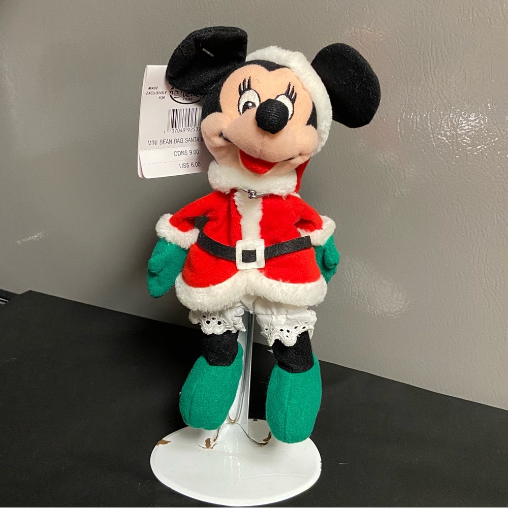 Vintage Disney Store Mini Bean Bag Minnie Santa. 7”. Tag intact. Great condition